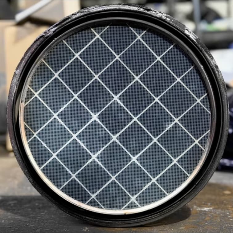 Professionally cleaned DPF filter element with clear honeycomb cells and no soot residue