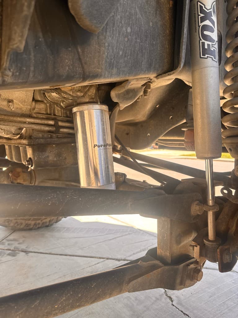 PurePower lifetime oil filter installed on a 6.7L Powerstroke diesel pickup